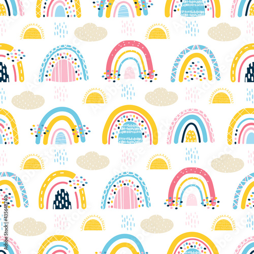 cute seamless pattern with baby rainbows, clouds, sun, rain. Stylized child's drawing. Design for scrapbooking, fabrics for baby clothes and bedding. Vector illustration drawn by hands