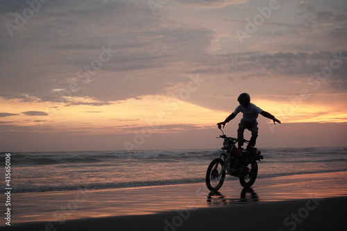 silhouette of a person on a bicycle