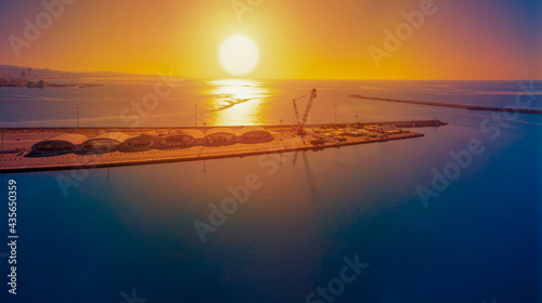 Obraz na plátně Bird's-eye view of the berthing facilities of the passenger port without ships at dawn