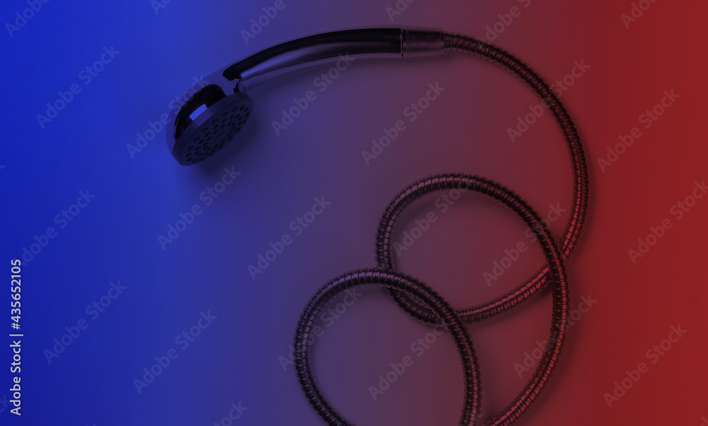 Shower head hose in neon light. Top view Shower head hose in neon light. Top view