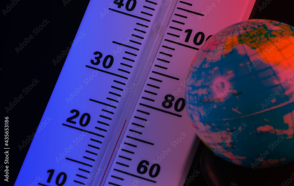 Climate control. Global warming. Weather thermometer with globe in neon light Climate control. Global warming. Weather thermometer with globe in neon light