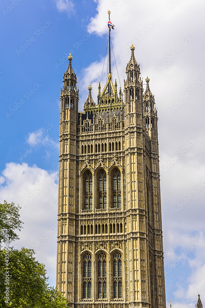 Victoria Tower - largest and tallest (98 m) tower of Palace of Westminster. Palace of Westminster (or Houses of Parliament) located in City of Westminster, London. Victoria Tower - largest and tallest (98 m) tower of Palace of Westminster. Palace of Westminster (or Houses of Parliament) located in City of Westminster, London.