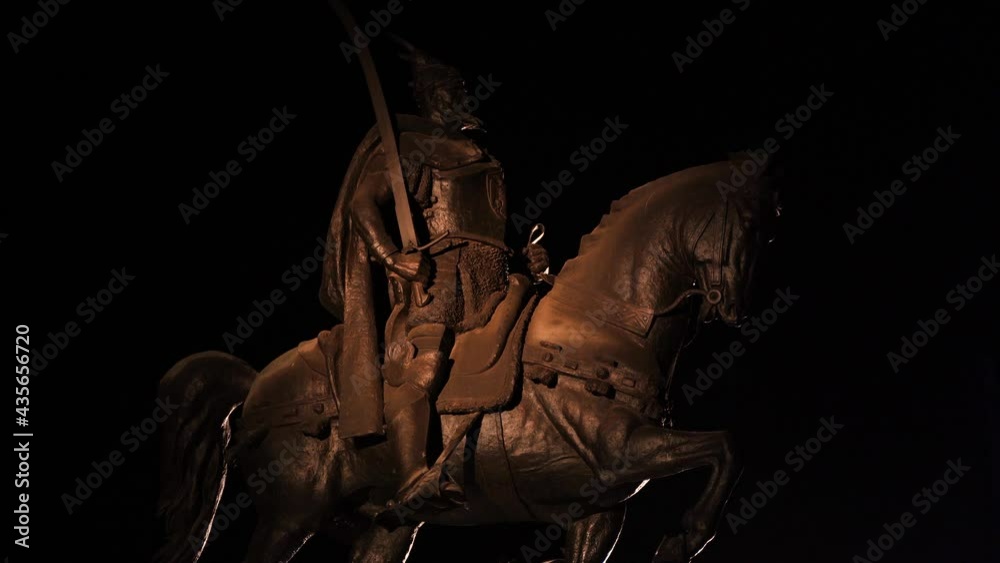 Monument of Albanian national hero Skanderbeg and his horse at night, black background Monument of Albanian national hero Skanderbeg and his horse at night, black background