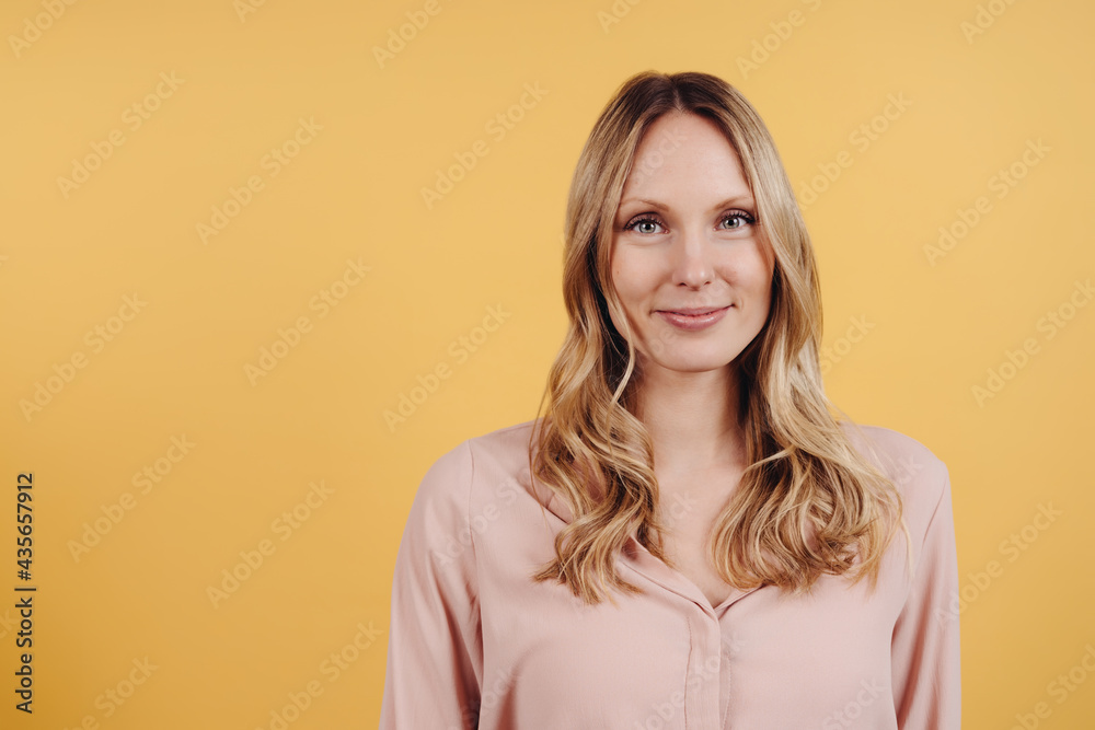 Attractive young blond woman with a sweet warm smile Attractive young blond woman with a sweet warm smile