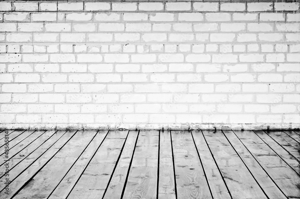 Brick wall and wood planks in old-style interior. Black And White
