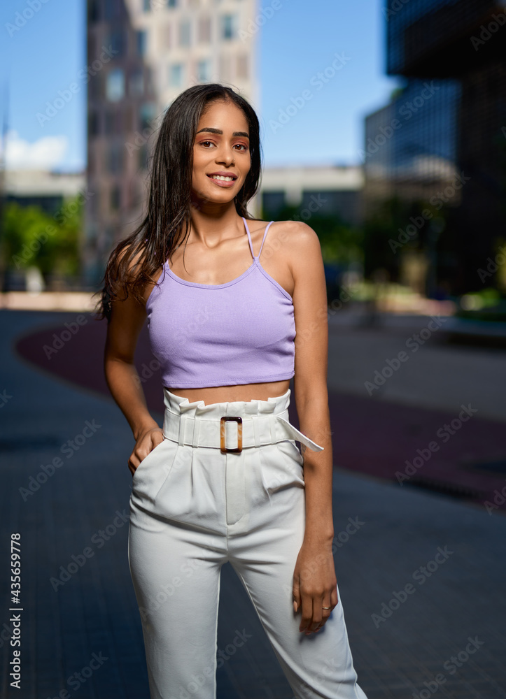 Portrait of young woman at outdoors.