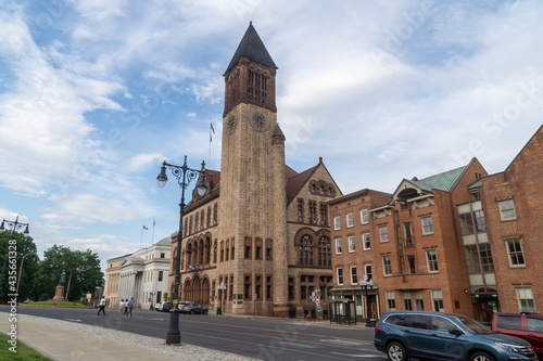 Albany, NY - USA - May 22, 2021: A landscape view of the historic Richardsonian Romanesque Albany City Hall, the seat of government of the city of Albany, New York. Featuring a 202-foot tall tower. photo