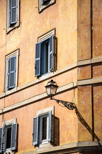 Street lamps on the walls of Italian cities