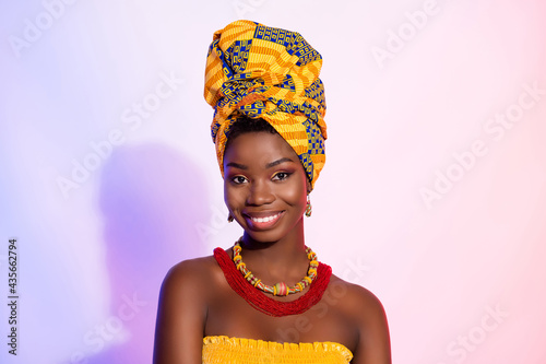 Obraz na plátně Photo of positive happy young dark skin woman smile face wear turban isolated on