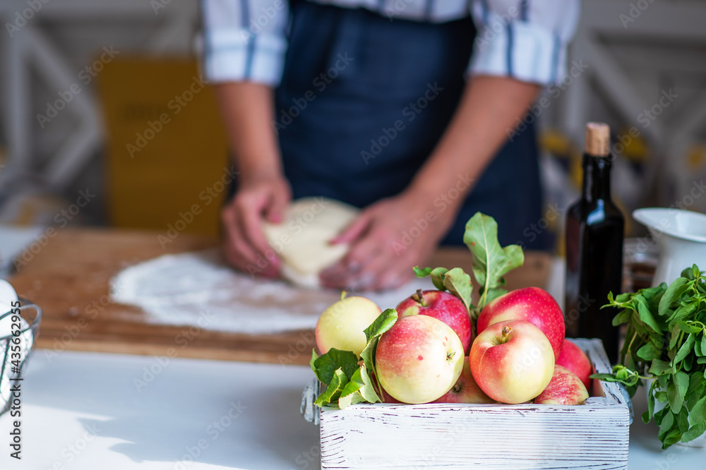 Female making dough. Dough, flour with accessories for the bakingin the composition on the kitchen table. Female making dough. Dough, flour with accessories for the bakingin the composition on the kitchen table.
