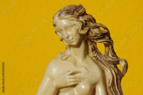 Scale reproduction of Botticelli's Birth of Venus on an orange background