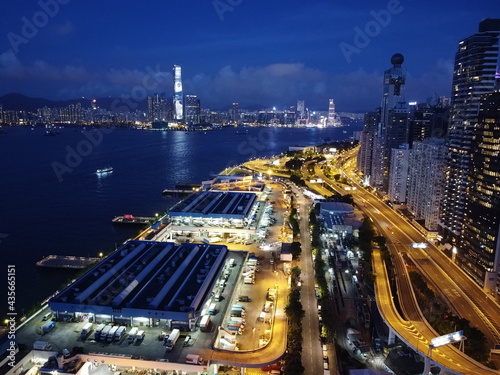 Ariel view of the western district wholesale food market in sai wan shek tong tsui area Hong kong with night lights over the roads transportation routes loading dock 