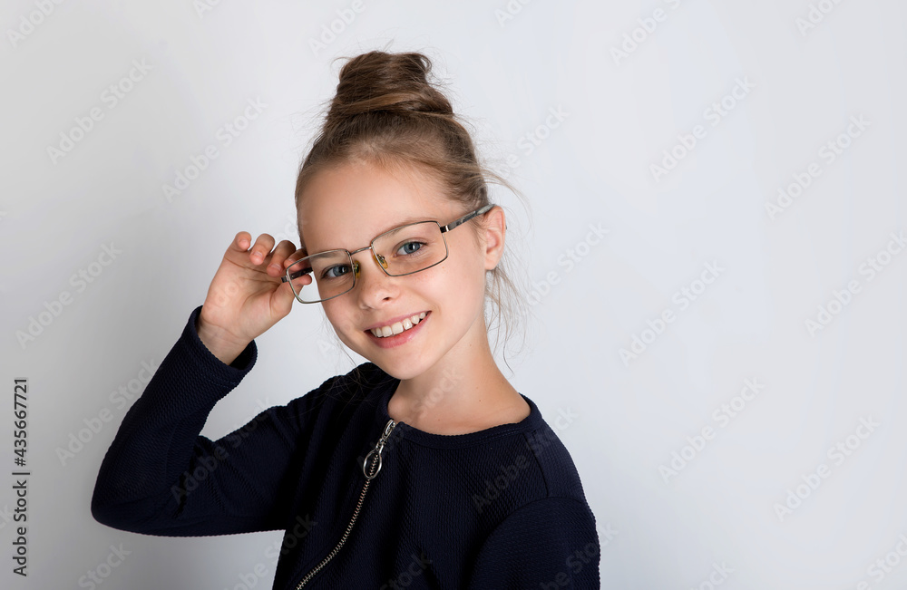 Beautiful cute smiling little girl with glasses Beautiful cute smiling little girl with glasses