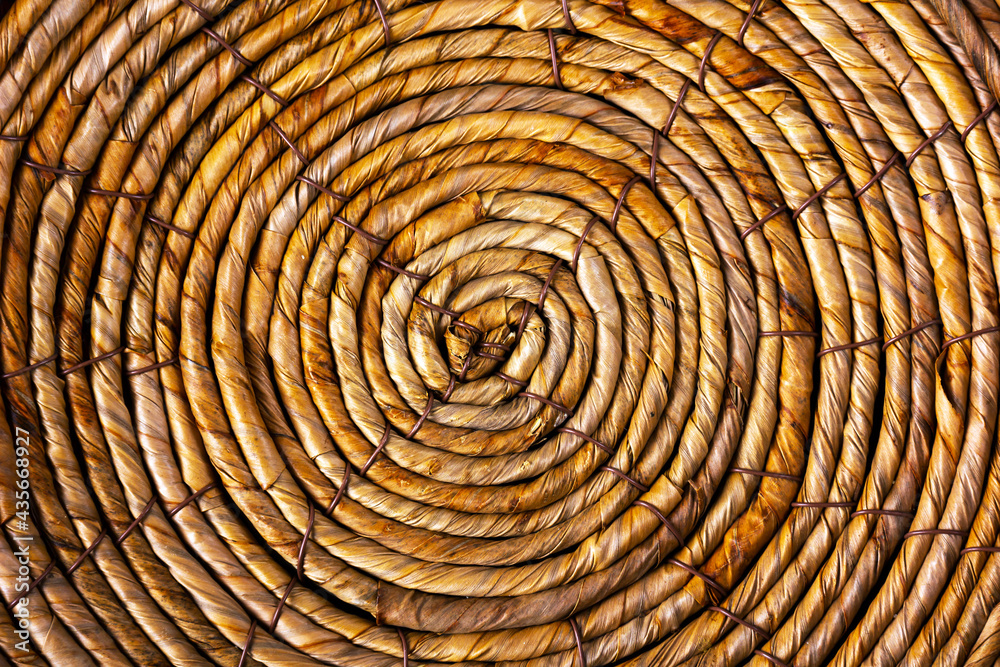 Spiral pattern of wicker basket bottom.