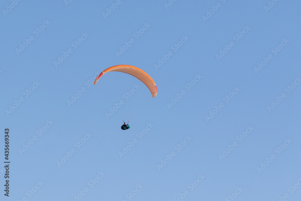 A paraglider enjoys the cliff top views of the South Downs Way at Beachy Head thanks to the light winds. A paraglider enjoys the cliff top views of the South Downs Way at Beachy Head thanks to the light winds.