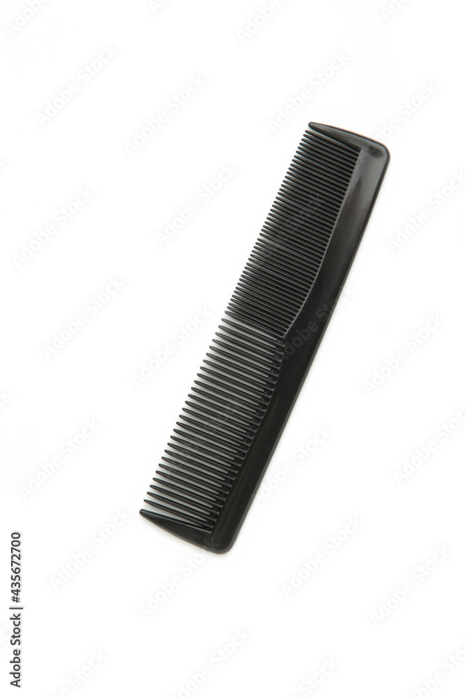 Black comb isolated on white background. Top view