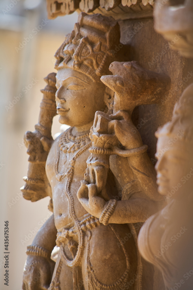 Detail of a statue belonging to the temple complex in Khajuraho. India. Fantastic art! Which stonemason can still work like this nowadays? Day. Normal perspective. 