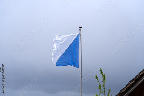 Flag of canton Zurich blowing in the wind. Photo taken May 25th, 2021, Zurich, Switzerland.