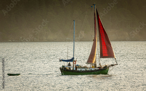 Quadro su tela Single handed cruising in a traditional ketch rigged sailboat
