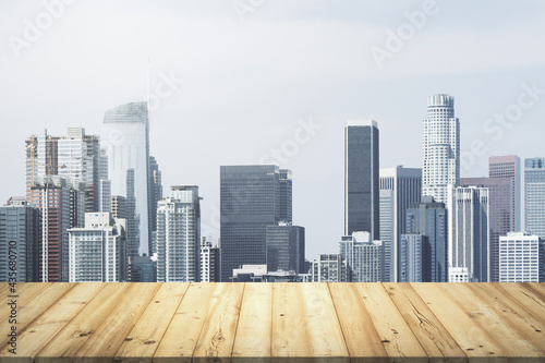 Wooden table top with beautiful Los Angeles skyline on background  mockup