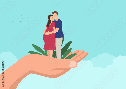 Husband embracing his pregnant wife on giant hand