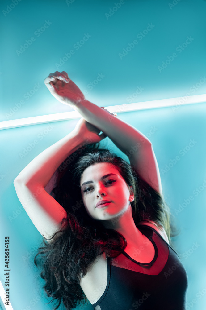 Foto de Laser epilation. Body hair removal. Skin treatment. Red neon