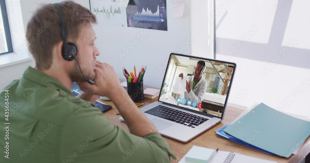 Caucasian businessman sitting at desk using laptop having video call with male colleague Caucasian businessman sitting at desk using laptop having video call with male colleague