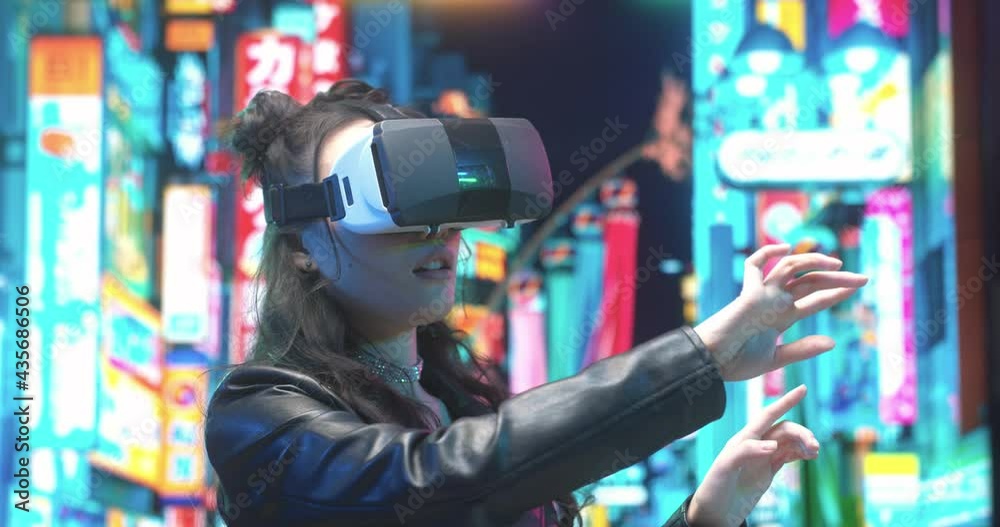 Virtual world. Happy young asian brunette woman having fun while using VR glasses and having exciting adventures in virtual world at the street. Technologies and people concept. Stock photo Virtual world. Happy young asian brunette woman having fun while using VR glasses and having exciting adventures in virtual world at the street. Technologies and people concept. Stock photo