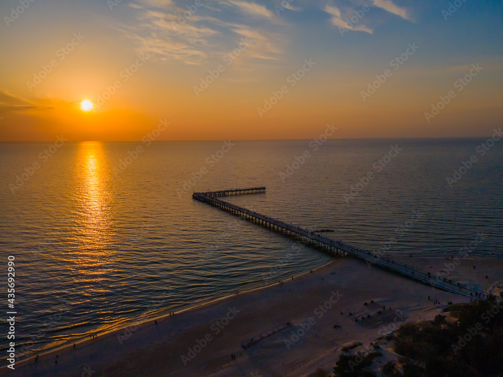 Aerial view of Palanga pedestrians bridge to the Baltic sea and a sunset in horizon