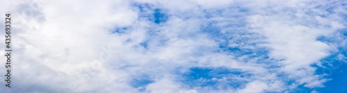 Clean blue sky with clouds panorama background