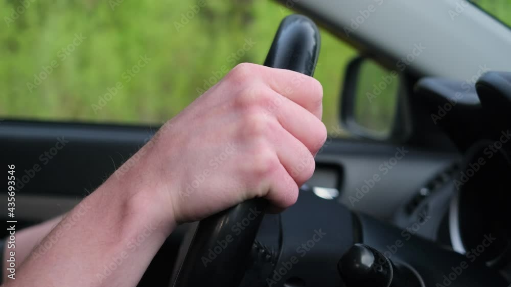 Car steering wheel turns. The concept of driving, driving on the road. Hands on the steering wheel close-up. Car steering wheel turns. The concept of driving, driving on the road. Hands on the steering wheel close-up.