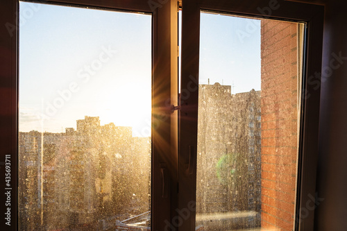 Принти на полотні sun rays illuminate home dirty window