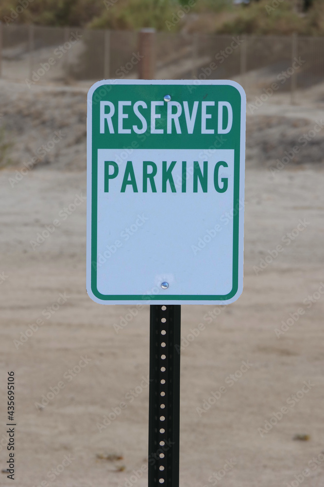 Posted green and white sign RESERVED PARKING Posted green and white sign RESERVED PARKING