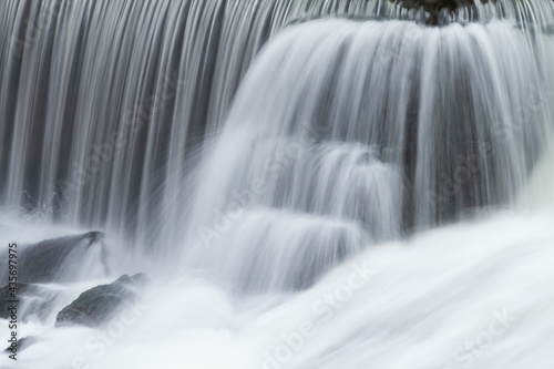 Landscape captured with motion blur of a cascade on the Rabbit River, Michigan, USA