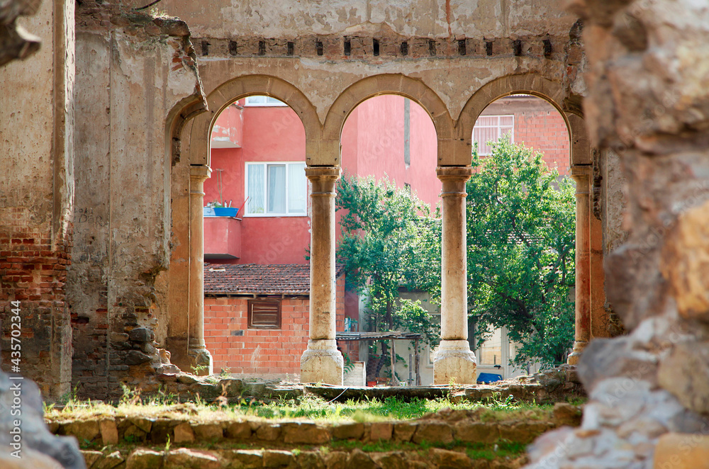 a ruined old building and columns