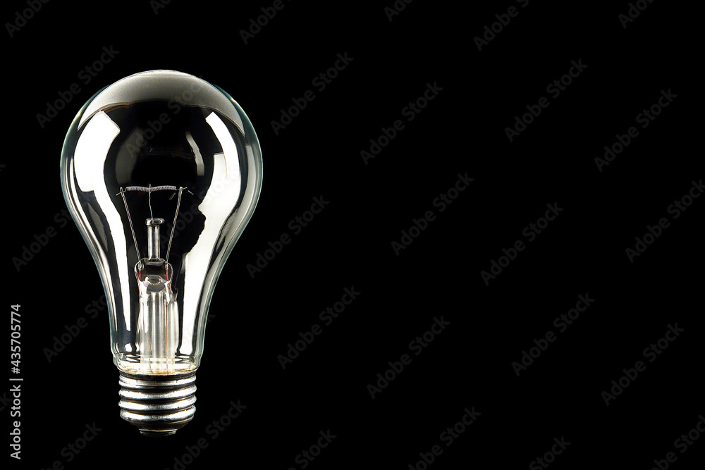 light bulb or bulb concept to express an idea isolated on black background with space for text light bulb or bulb concept to express an idea isolated on black background with space for text