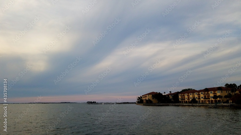 Swirly dark clouds over the water