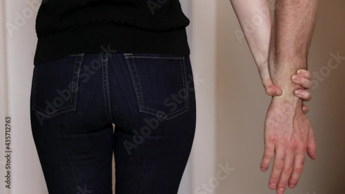 Abstract concept sexual assault, rape, groping, mans hand grabbing woman, unwanted attention, fighting back. 4K 24FPS.