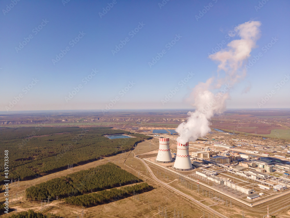 Fototapeta premium Aerial view of Industrial zone with power station atomic energy production. Nuclear power plant production clean energy.