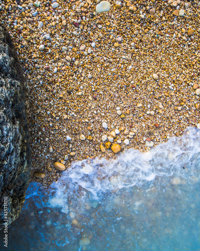 Wonderful contrast between the rocky shore and the radiant sea