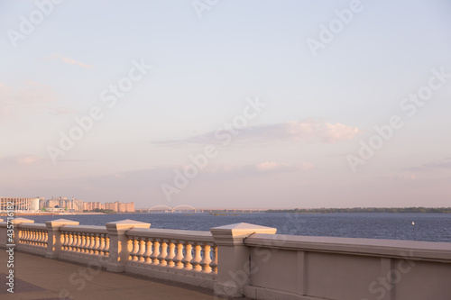 Sunset or sunrise on the river embankment at summer evening