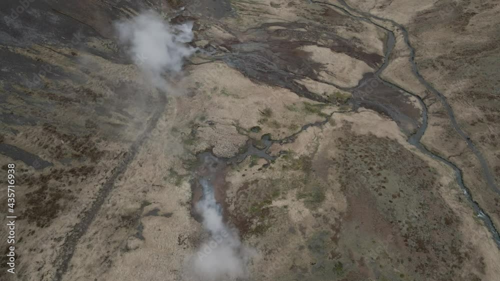 Fumaroles and thermal waters at Reykjadalur in Iceland. Aerial forward tilt up Fumaroles and thermal waters at Reykjadalur in Iceland. Aerial forward tilt up