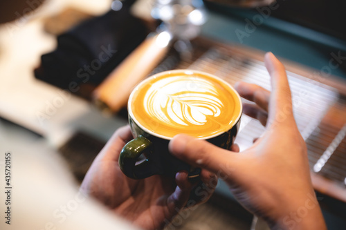 professional barista making espresso coffee to a drink cup in cafe, beverage caffeine machine, person pouring hot water with hand, business in the morning breakfast, fresh aroma in hot drink