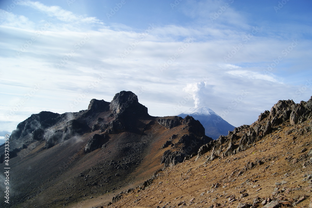 Volcano with snow, fog and sun Volcano with snow, fog and sun