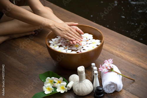 Spa Thai setting for aroma therapy and sugar and salt massage with flower on the bed, relax and healthy care. Healthy Concept