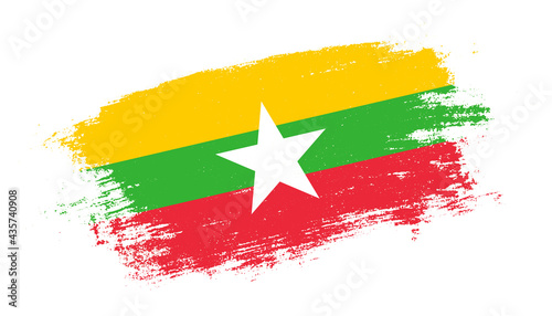Flag of Myanmar country on brush paint stroke trail view. Elegant texture of national country flag