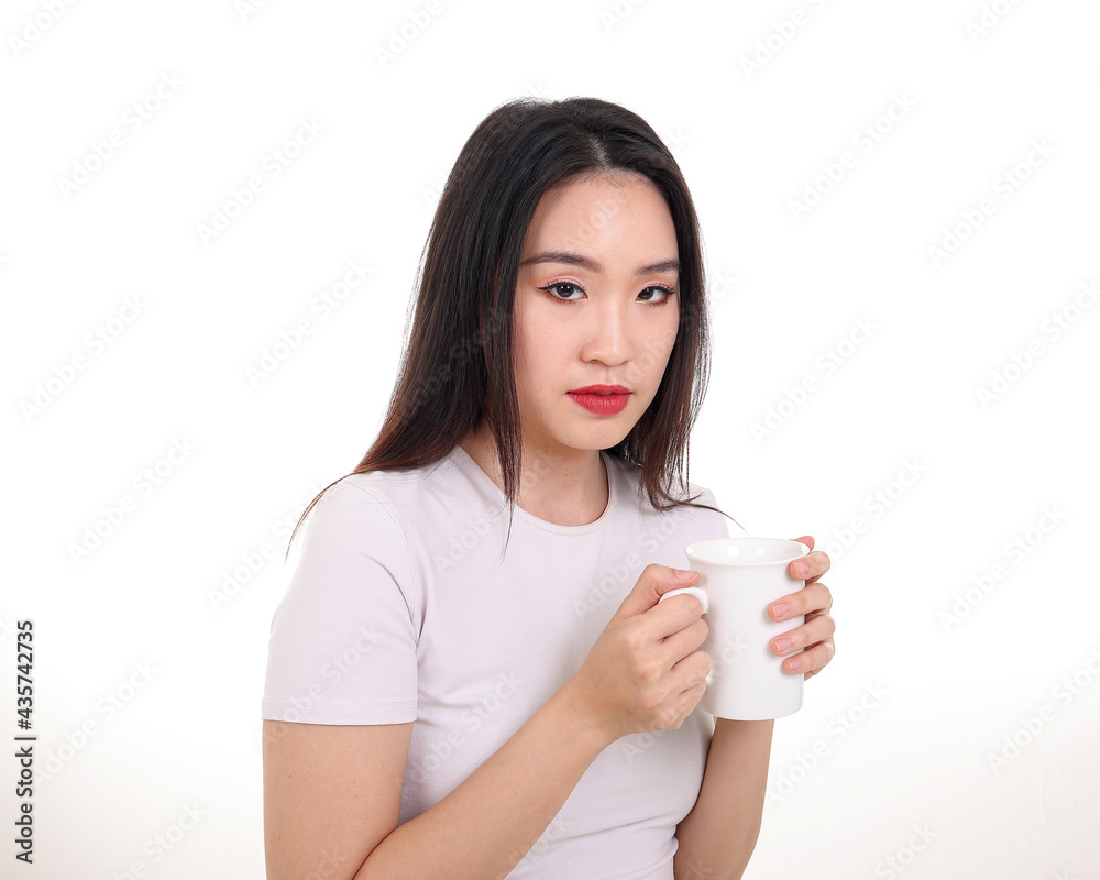 Beautiful young south east Asian woman holding white coffee tea cup emotion expression on white background look at camera