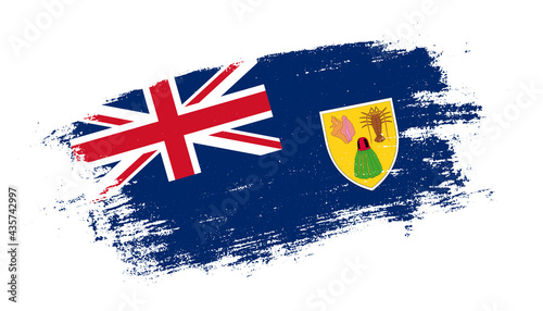 Flag of Turks and Caicos Islands country on brush paint stroke trail view. Elegant texture of national country flag
