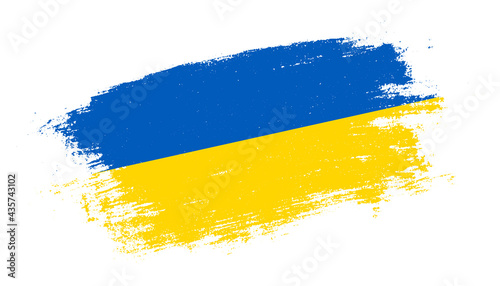 Flag of Ukraine country on brush paint stroke trail view. Elegant texture of national country flag