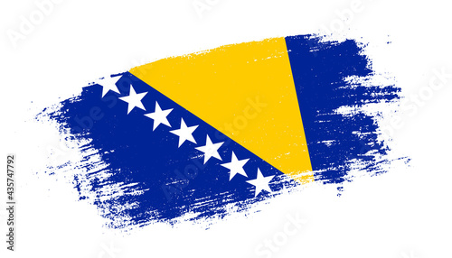 Flag of Bosnia and Herzegovina country on brush paint stroke trail view. Elegant texture of national country flag